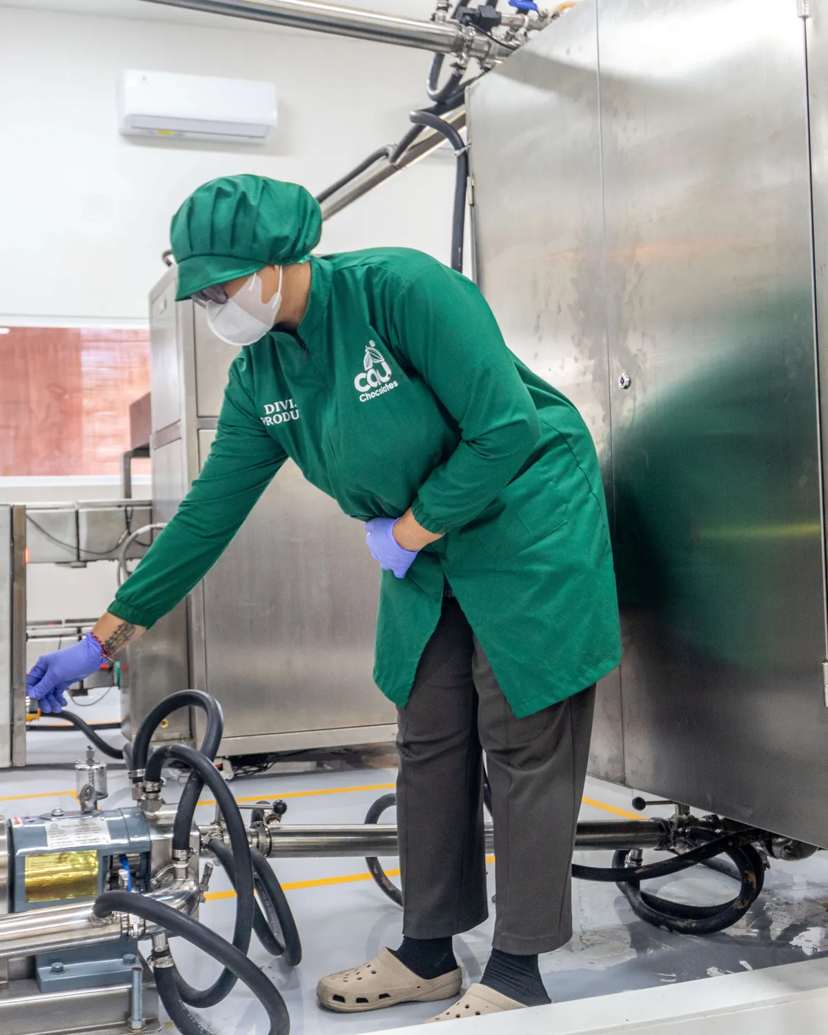 A CAU production team member at work on the chocolate production line